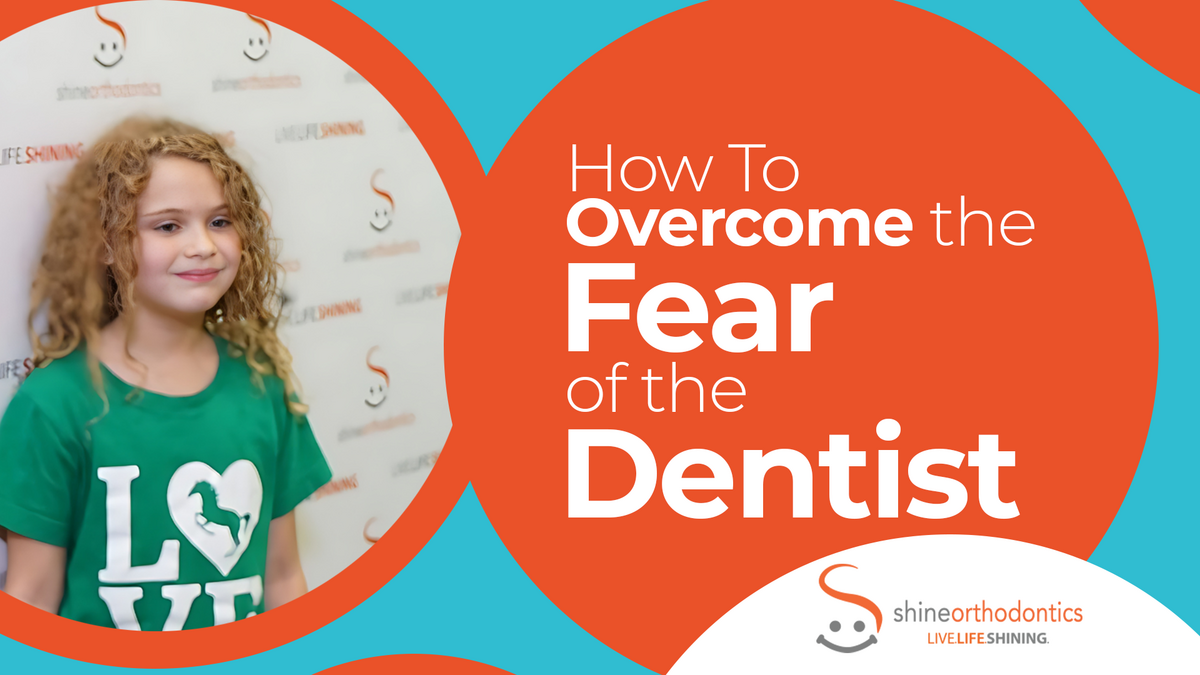 Little girl with green shirt smiling with text "How To Overcome the Fear of the Dentist"